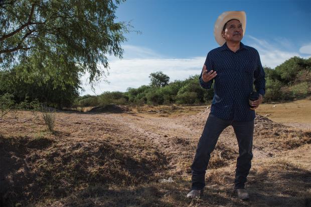 Mario Luna Romero stands alo<em></em>ngside a section of the dried-up Yaqui River in Vícam Pueblo